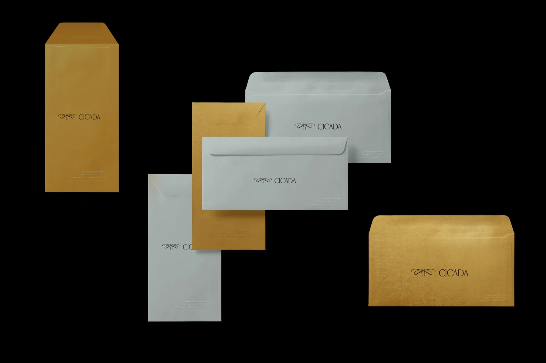 A set of Cicada envelopes in gold and grey, each carrying the emblem and wordmark